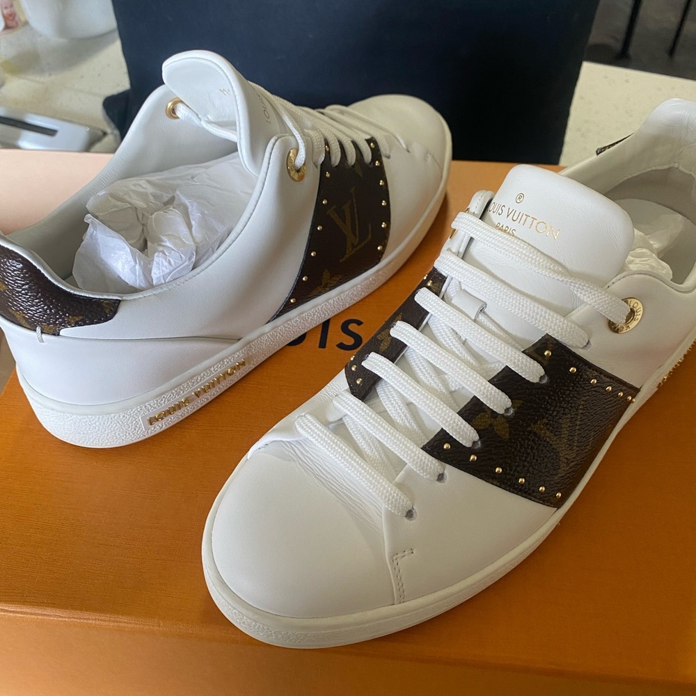 Louis Vuitton front row sneakers.